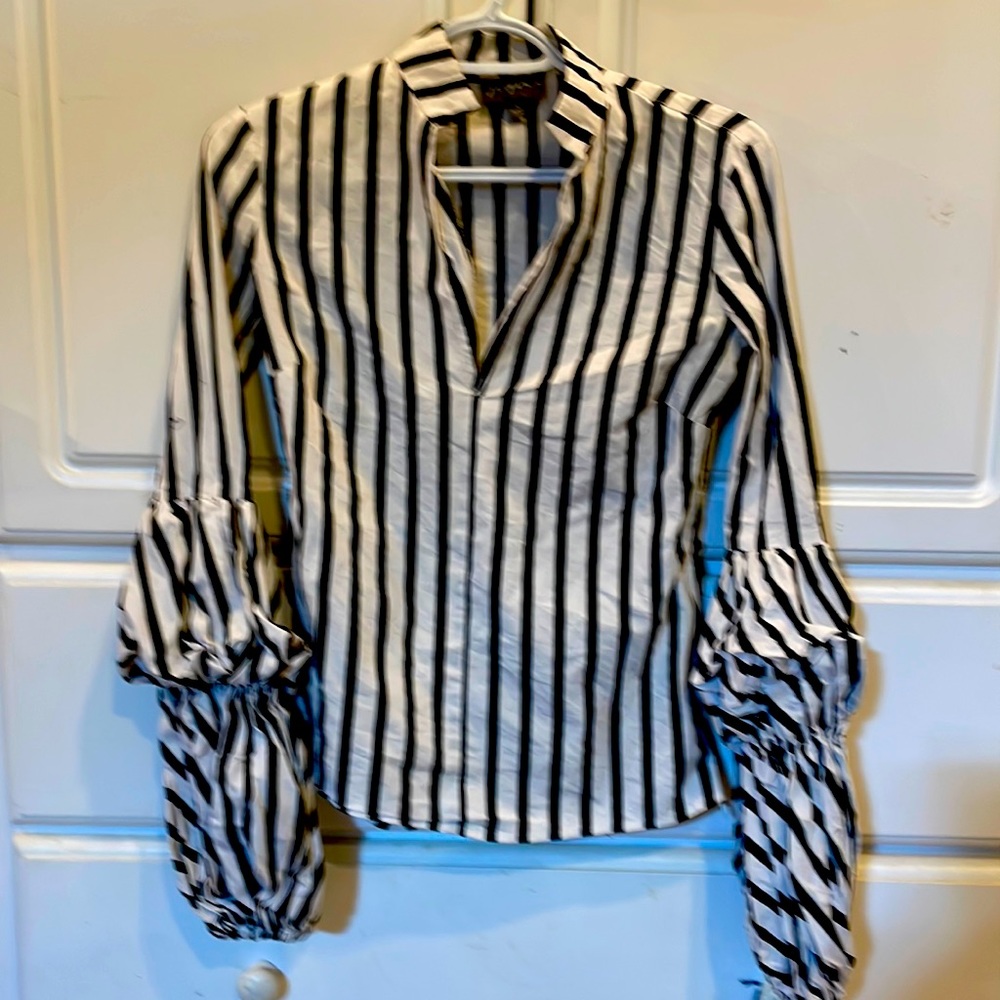 Black and white puffy long sleeved shirt.